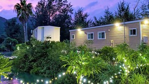 A modern house with a garden and a pond. - Le Grand Bleu (Tatsugo)
