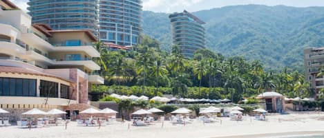 On the beach, sun-loungers, beach towels