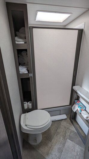Shower, hair dryer, towels, soap