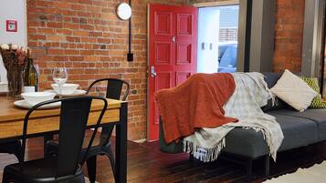 Deluxe Apartment | Living area | 55-inch Smart TV with digital channels