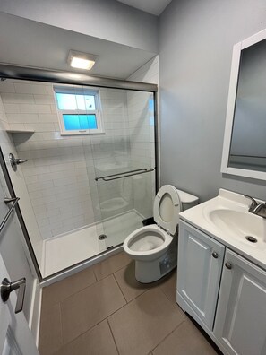 Shower, towels, soap, toilet paper