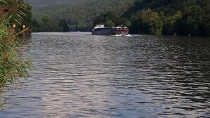 A river with a boat moving towards the viewer. - Apartment 'Collenberger Ferienwohnung Schäfer' with Private Terrace, Garden & Wi-Fi (Collenberg)