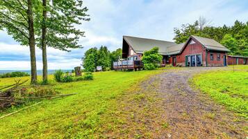 Situated in a serene natural setting, this charming barn-style building offers a peaceful retreat.