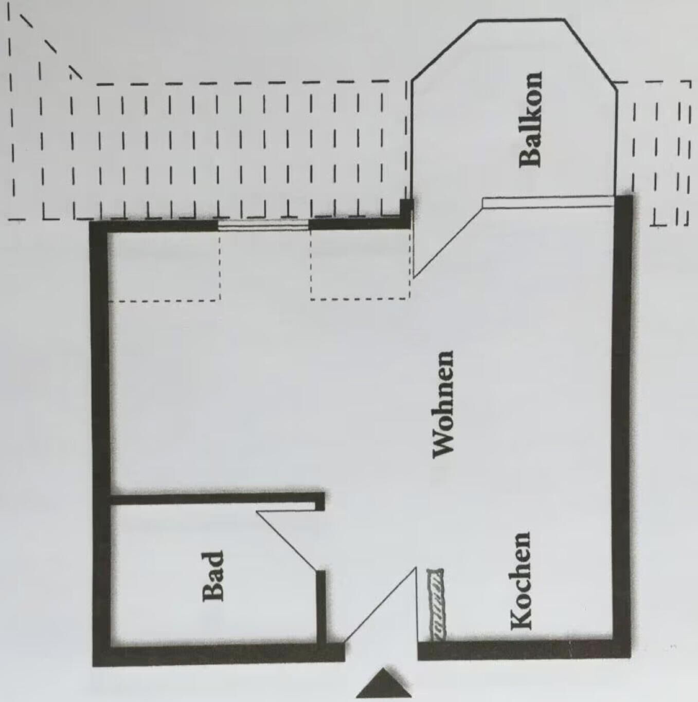 Un plan d’étage comprenant un espace de vie, une cuisine, une salle de bain et un balcon.