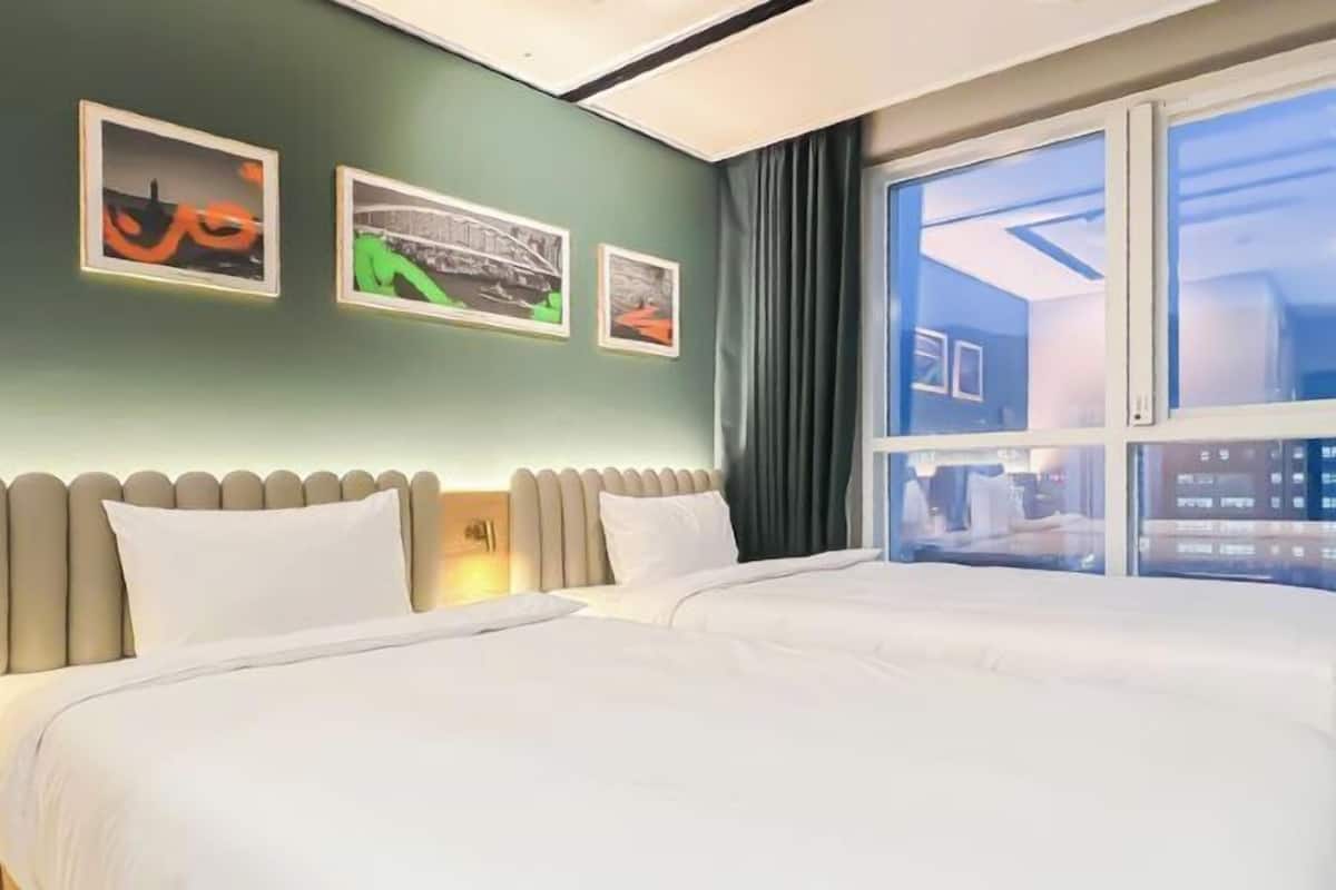Desk, laptop workspace, free WiFi, bed sheets