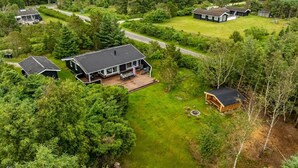 A residential area with multiple houses surrounded by dense forest. - "Anouk" - 2km from the sea by Interhome (Saltum)