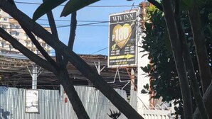 A sign for a hotel with a price tag of 1800 pesos per night. - Wjv Inn Marigondon (Lapu-Lapu)