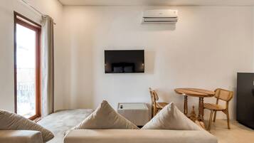 Standard Double Room, Pool View | Living area | LED TV