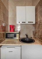 Estudio Confort, bañera | Cocina privada