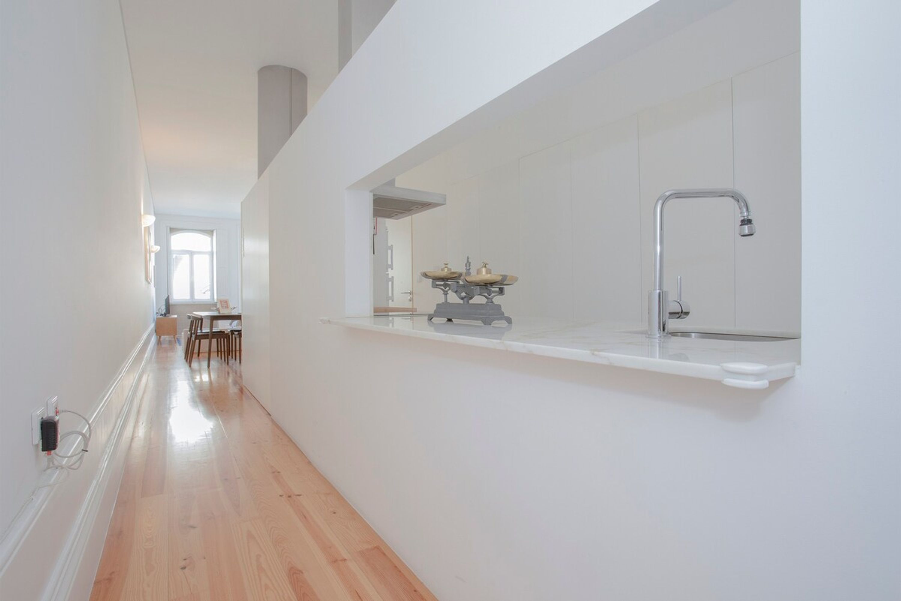 A modern kitchen with a built-in sink and a window above the countertop.
