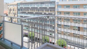 A modern building with multiple floors, large windows, and a metal railing. - Allegro Boutique Apartment B by Liiiving (Porto)