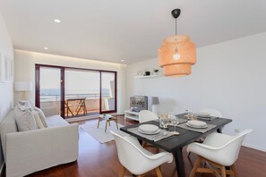 Enjoy a meal at the dining table with a view of the outdoors.