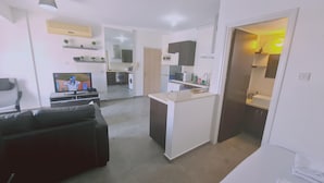 A modern apartment with a living room, kitchen, and dining area. - 17 MAK - Stay Universal Studio (Egkomi)