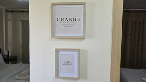 Two framed inspirational quotes on a wall in a hotel room. - 123 AN - Stay Nissi House (Ayia Napa)