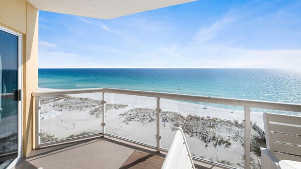 A balcony with a view of a beach and ocean. - Breathtaking Gulf Views! Community Pool! Steps to the Gulf! (Pensacola Beach)