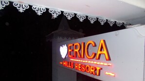 A neon sign for 'ERICA HILLS RESORT' with a heart symbol. - Erica Hills Resort Kasauli (Solan)