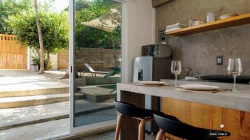 Fridge, microwave, coffee/tea maker, cookware/dishes/utensils