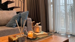 Deluxe Apartment | Living area | 50-inch Smart TV with digital channels - NVT Housing - PentStudio West Lake Hanoi (Hanoi)