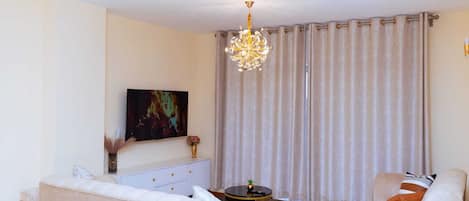 Family Apartment | Living area | 24-inch Smart TV with digital channels