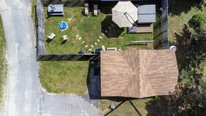 An aerial view of a backyard with a patio area, a swimming pool, and a large umbrella. - Mountain views Hiking by Day & Hot tub by night #2 (Carroll)