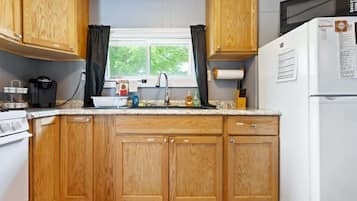 Fridge, microwave, stovetop, coffee/tea maker