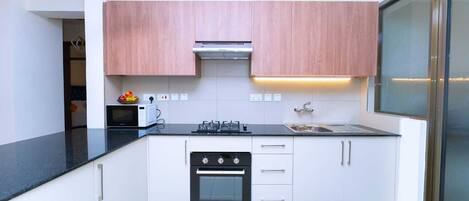 Deluxe Apartment, Balcony, City View | Private kitchen | Microwave, cookware/dishes/utensils
