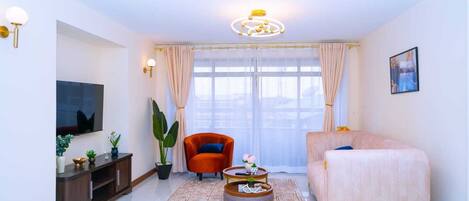 Deluxe Apartment, Balcony, City View | Living area | 32-inch Smart TV with digital channels