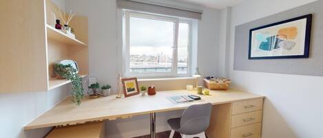 Desk, laptop workspace, free WiFi, bed sheets