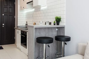 Signatur-lejlighed | Privat køkken | Minikøleskab, ovn, kogeplade, elkedel