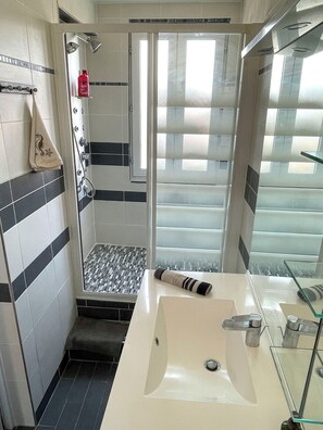 Shower, hair dryer, towels, soap