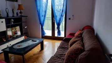 House (Holiday Home Marina - Two Bedroom Hol) | Living room | 32-inch flat-screen TV with satellite channels