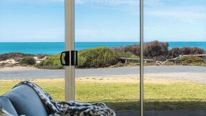 A view through a window with a beach and ocean in the background. - Seascape at Boomer 2 Ocean Rd, Port Elliot (Port Elliot)