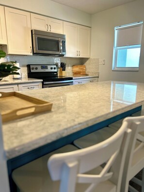 Fridge, microwave, oven, stovetop - Escape to the Cape at Ebb Tide 1-bedroom 1-bath condo - 5 minute walk to beach (Cape Canaveral)