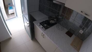 Triple Room, Balcony | Private kitchen