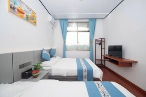 A hotel room with two beds, a TV on a wooden stand, a window with curtains, and a painting on the wall. - Meizhou Island Beach House Resort Hotel (Putian)