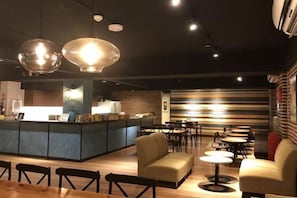 A modern interior with a bar area, seating, and a counter. - Jiufen Sunshine (New Taipei City)