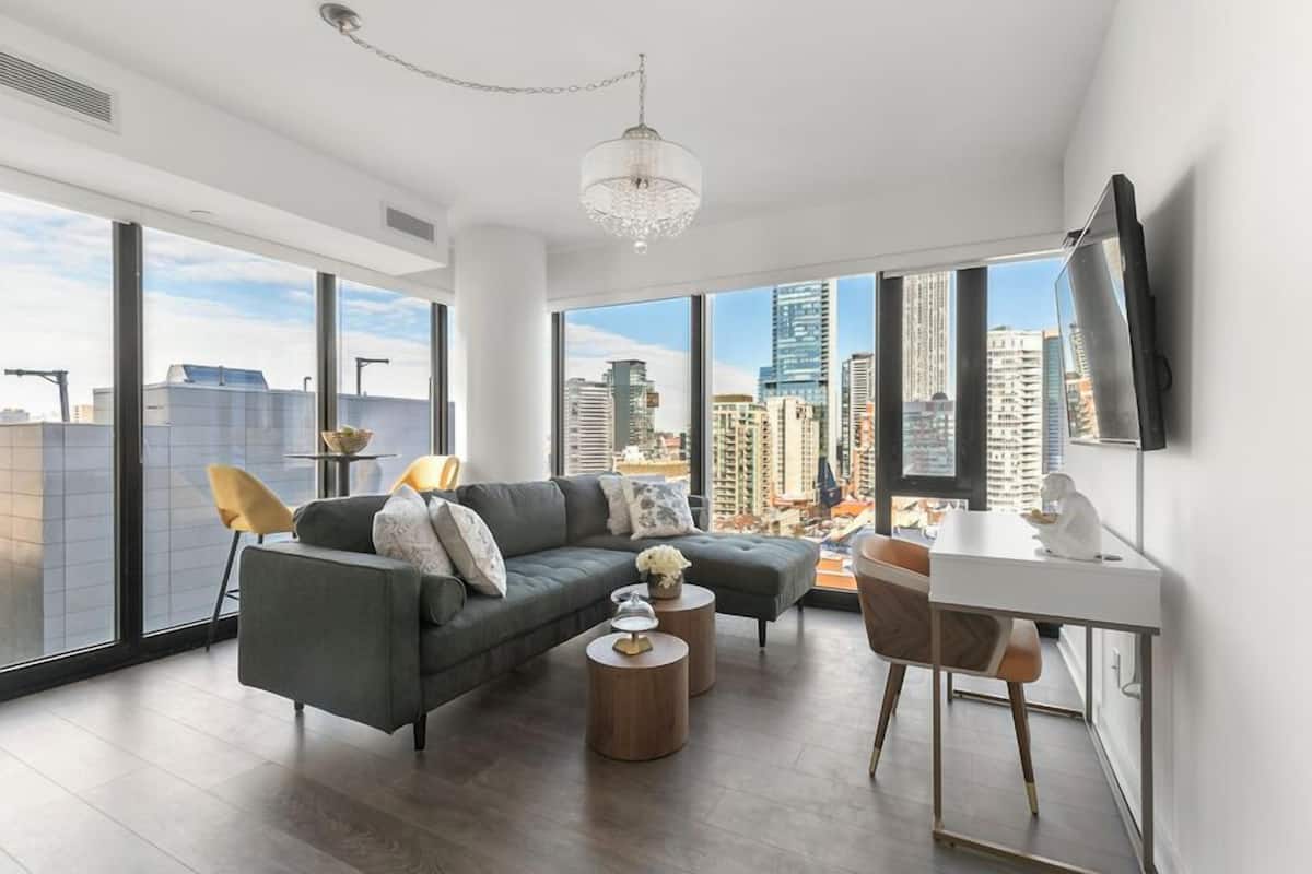 Executive Suite, City View | Living area | 55-inch flat-screen TV with cable channels