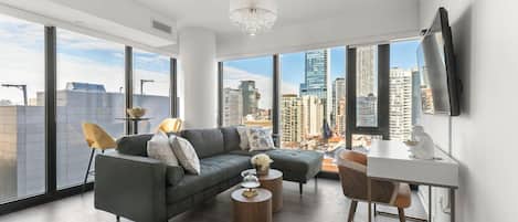 Executive Suite, City View | Living area | 55-inch flat-screen TV with cable channels