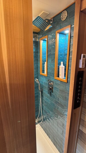 Shower, towels, soap, shampoo - "City Hideaway: Off-Grid Luxe" (Lancaster)
