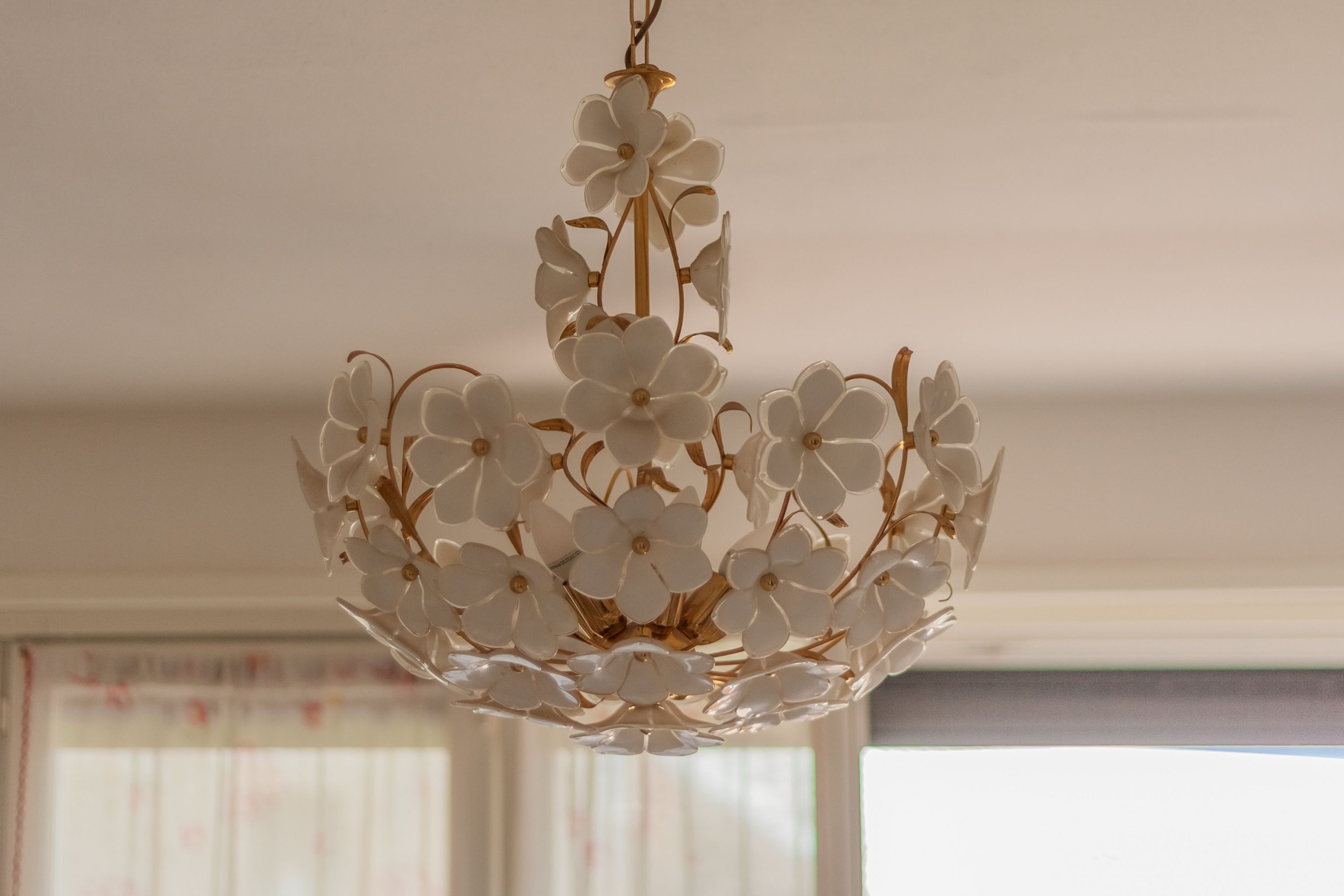 A chandelier with a floral design.