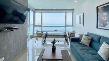 Panoramic Apartment | Living area | Flat-screen TV