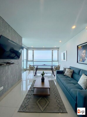 Apartamento panorámico | Zona de estar | Una televisión de pantalla plana