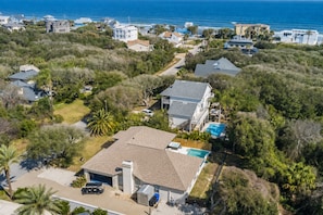 An aerial view of a residential area with houses, a swimming pool, and a garage. - Heated Pool-Hot Tub-Pet Friendly-Steps to Beach (Saint Augustine)