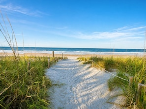 A sandy beach path leading to the ocean with a clear sky. - Heated Pool-Hot Tub-Pet Friendly-Steps to Beach (Saint Augustine)