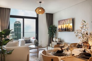 Luxury Apartment, City View | Living area | 65-inch Smart TV with digital channels, Netflix, streaming services - Sky High Ocean View Opposite Dubai Mall (Dubai)