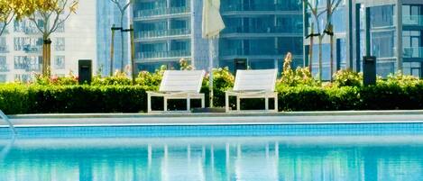 2 outdoor pools, open 6:30 AM to 10:00 PM, pool umbrellas, pool loungers