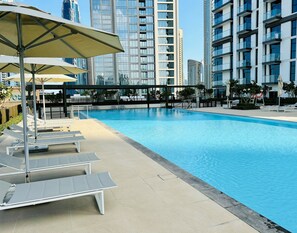 2 outdoor pools, open 6:30 AM to 10:00 PM, pool umbrellas, pool loungers