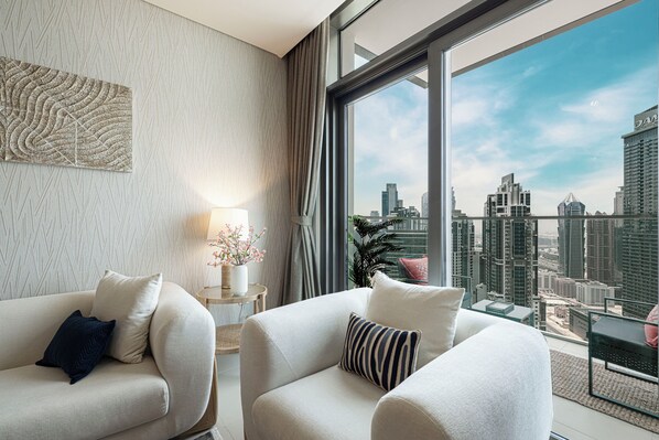 Luxury Apartment, City View | Living area | 65-inch Smart TV with digital channels, Netflix, streaming services - Sky High Ocean View Opposite Dubai Mall (Dubai)