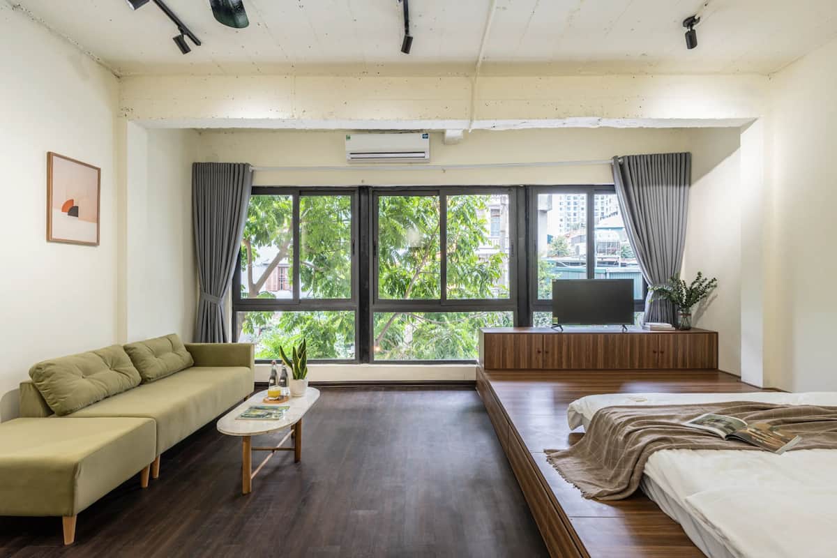 Deluxe Studio, City View | Living area | 30-inch LCD TV with cable channels, first-run movies