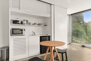 Fridge, microwave, coffee/tea maker, dining tables